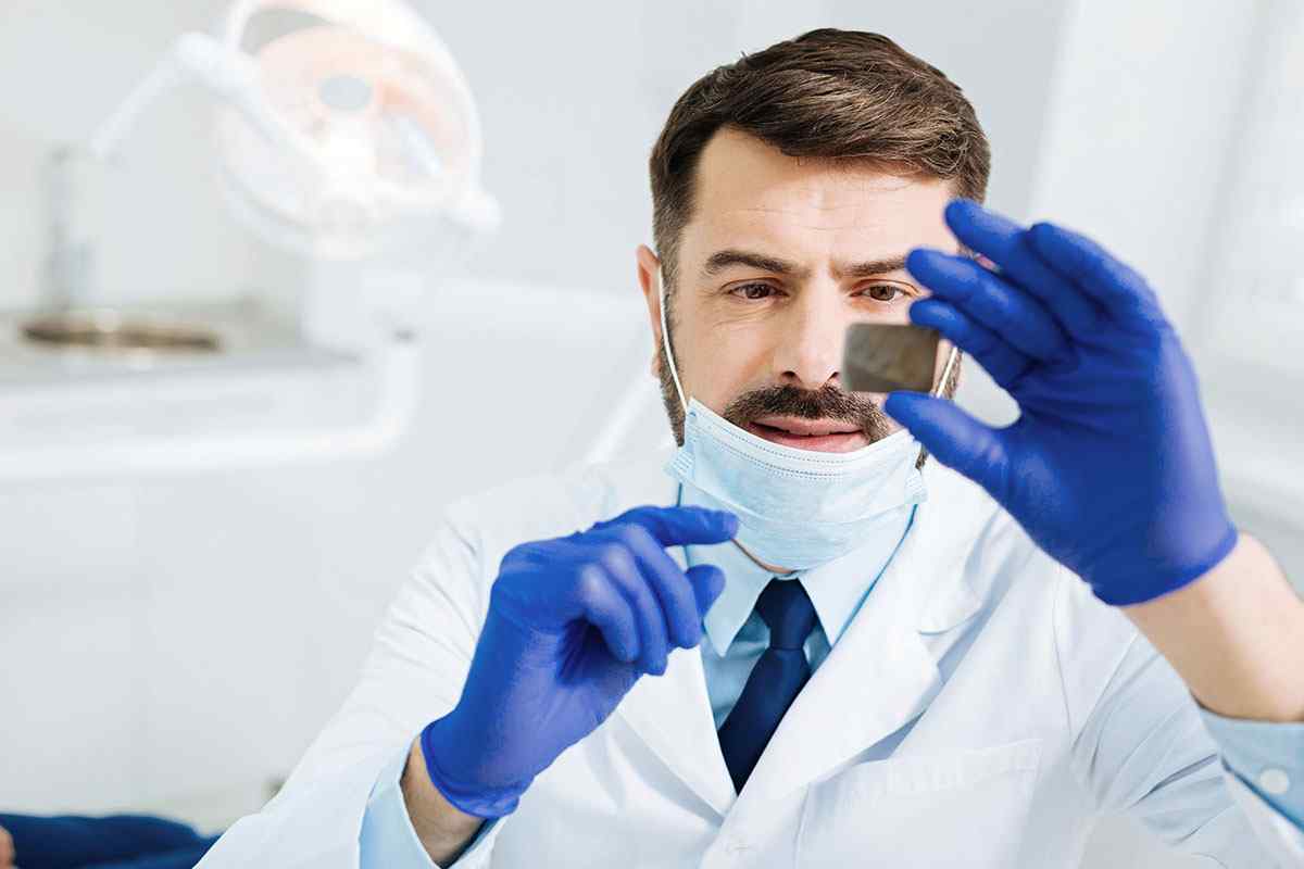 Dentist about to perform endodontics surgery